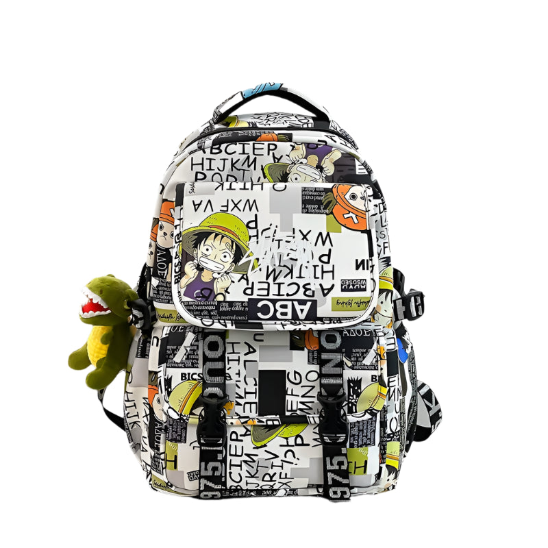Backpack with cartoon character design on a desk with a laptop and toy.