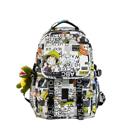 Backpack with cartoon character design on a desk with a laptop and toy.